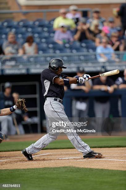 Endy Chavez of the Seattle Mariners makes some contact at the plate during the game against the San Diego Padres at Peoria Sports Complex on February...