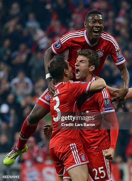 Thomas Mueller of Bayern Muenchen celebrates with team mates after scoring his teams second goal during the UEFA Champions League quarter final...