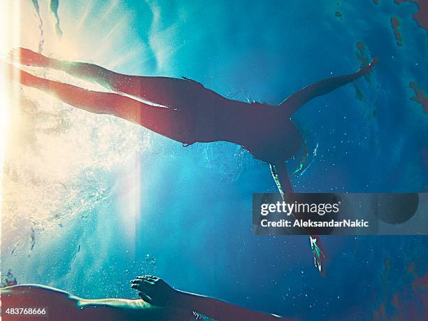 freedom - girl diving stockfoto's en -beelden