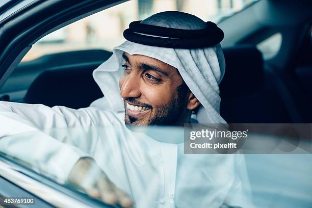 emirati businessman in a car - united arab emirates people stock pictures, royalty-free photos & images