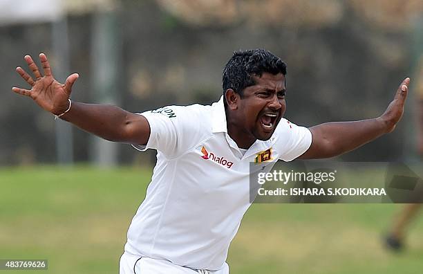 Sri Lankan cricketer Rangana Herath successfully appeals for a Leg Before Wicket decision against Indian cricket team captain Virat Kohli during the...