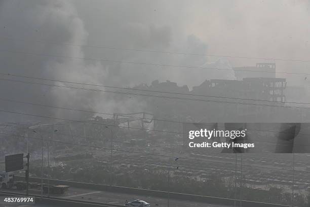 Accident site is still smoking after explosions of a warehouse on late Wednesday in Binhai New Area on August 13, 2015 in Tianjin, China. At least 17...