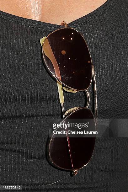 Actress Tricia Helfer, sunglasses detail, arrives at the 6th annual Kiehl's LifeRide for amfAR celebration at Kiehl's Since 1851 on August 12, 2015...