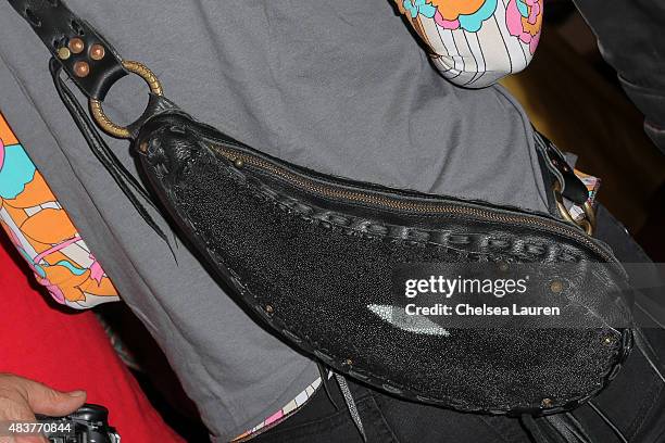 Actress Kristy Swanson, purse detail, arrives at the 6th annual Kiehl's LifeRide for amfAR celebration at Kiehl's Since 1851 on August 12, 2015 in...