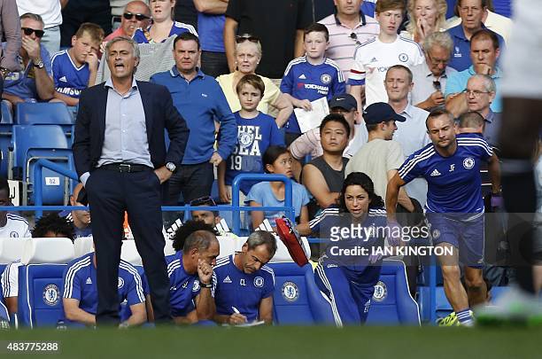 Chelsea doctor Eva Carneiro and head physio Jon Fearn leave the bench to treat Chelsea's Belgian midfielder Eden Hazard late in the game as Chelsea's...