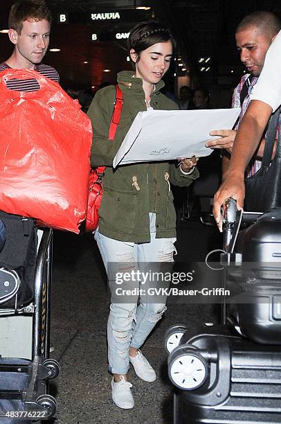 Lily Collins is seen at LAX on August 12, 2015 in Los Angeles, California.