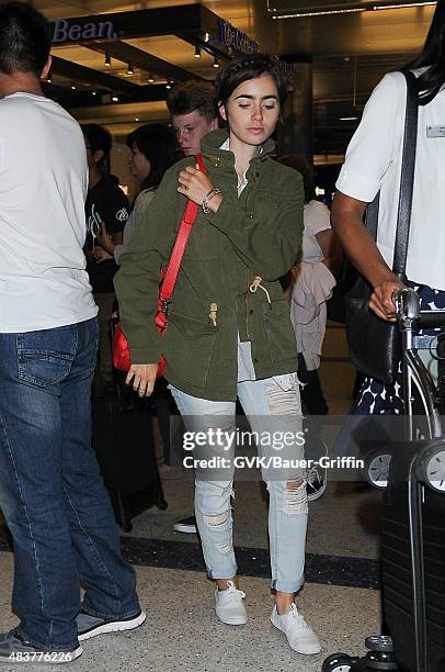 Lily Collins is seen at LAX on August 12, 2015 in Los Angeles, California.