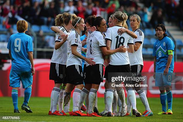 Anja Mittag of Germany celebrates his team's fourth goal with team mates during the FIFA Women's World Cup 2015 qualifying match between Germany and...