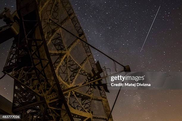 Perseid meteor streaks across the sky above the radar near the Astronomical Institute of the Academy of Science of the Czech Republic on August 12,...