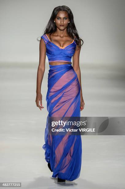 Model walks the runway during Samuel Cirnansck show at Sao Paulo Fashion Week Spring Summer 2014/2015 at Parque Candido Portinari on April 4, 2014 in...