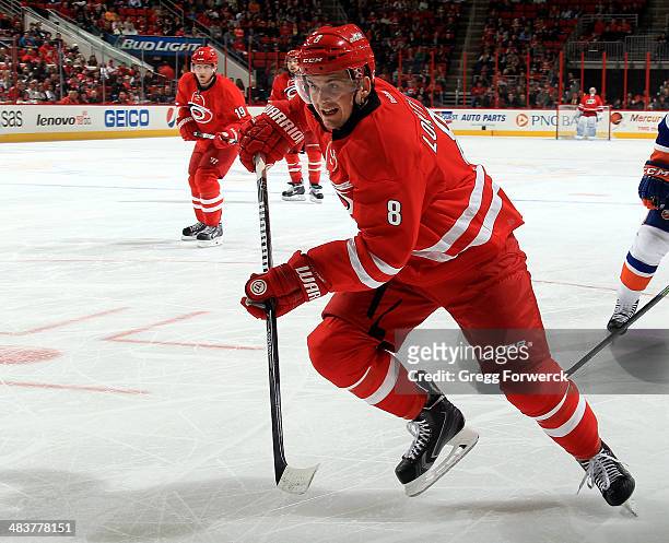 Andrei Loktionov of the Carolina Hurricanes skates for position on the ice during their NHL game at PNC Arena on March 25, 2014 in Raleigh, North...