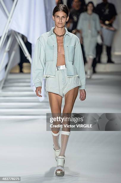 Model walks the runway during Ellus show at Sao Paulo Fashion Week Spring Summer 2014/2015 at Parque Candido Portinari on April 4, 2014 in Sao Paulo,...