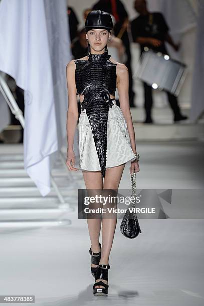 Model walks the runway during Ellus show at Sao Paulo Fashion Week Spring Summer 2014/2015 at Parque Candido Portinari on April 4, 2014 in Sao Paulo,...