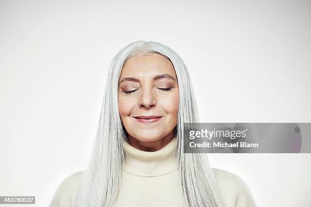 head and shoulders portrait of mature woman - eyes closed bildbanksfoton och bilder