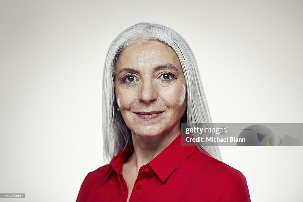 Head and shoulders portrait of mature woman