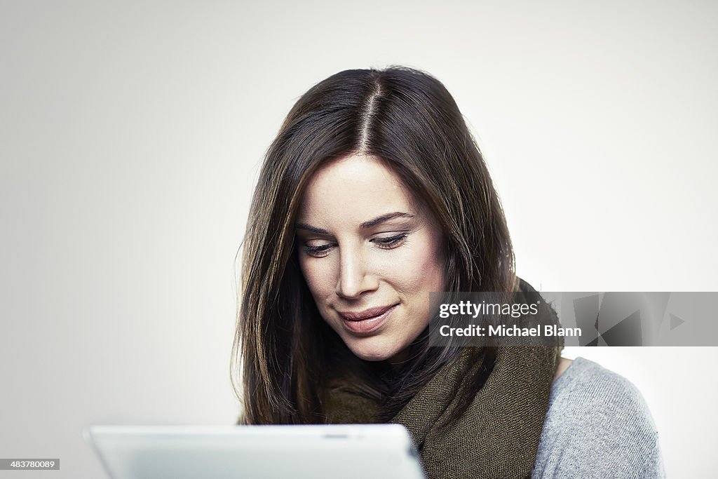 Portrait of woman with tablet