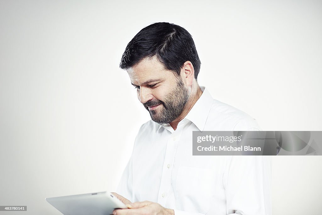 Portrait of a man with tablet