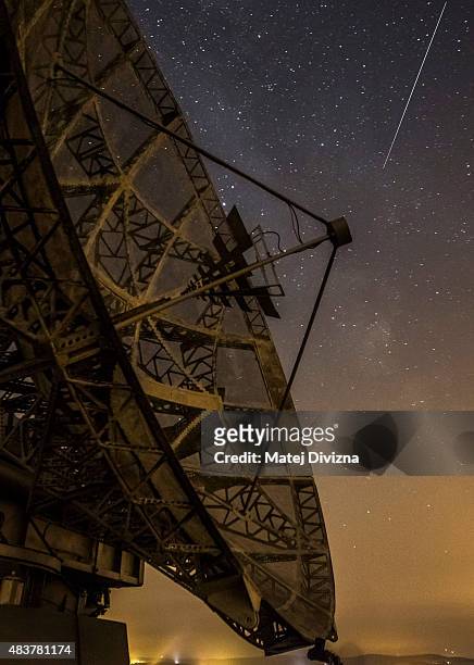 Perseid meteor streaks across the sky above the radar near the Astronomical Institute of the Academy of Science of the Czech Republic on August 12,...