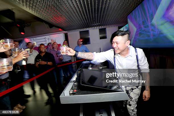 Poet of the Black Eyed Peas shares a drink with guests of the Lenovo ThinkPad P Series launch party at Siggraph 2015 on August 12, 2015 in Los...