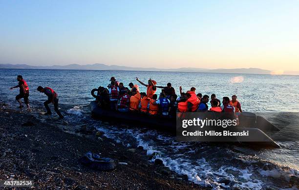 Dinghy overcrowded with Syrian migrants approaches a beach on the Greek island of Kos after crossing a part of the Aegean sea from Turkey to Greece...