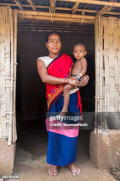 tribal woman from india with her child in traditional attire - india tribal people stock pictures, royalty-free photos & images