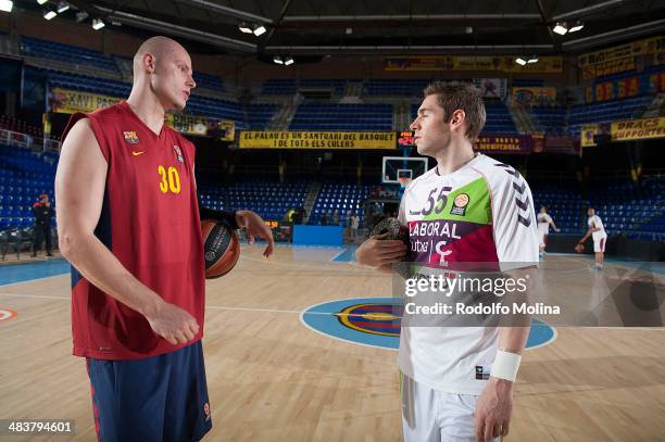 Maciej Lampe, #30 of FC Barcelona talking to Fabien Causeur, #55 of Laboral Kutxa Vitoria before the 2013-2014 Turkish Airlines Euroleague Top 16...