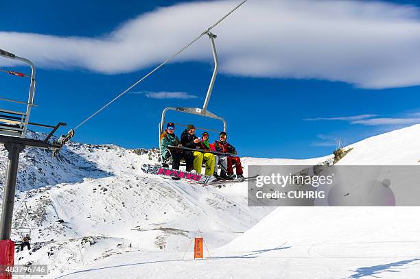 ski field chair lift snow boarders - queenstown stock pictures, royalty-free photos & images