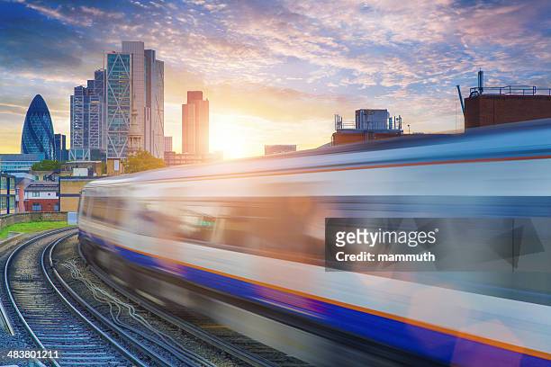 london overground with skyscrapers in the background - uk stock pictures, royalty-free photos & images
