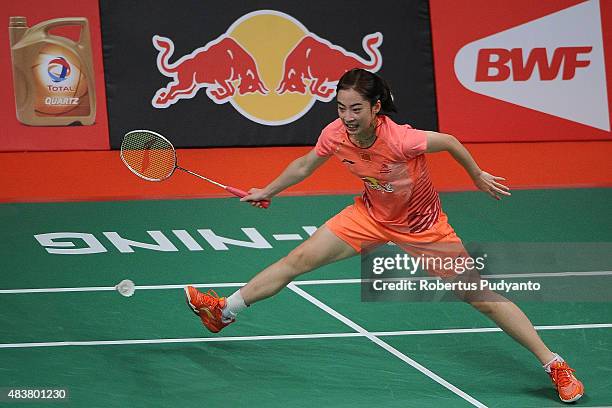 Wang Shixian of China competes against Busanan Ongbumrungpan of Thailand in the 2015 Total BWF World Championship at Istora Senayan on August 13,...