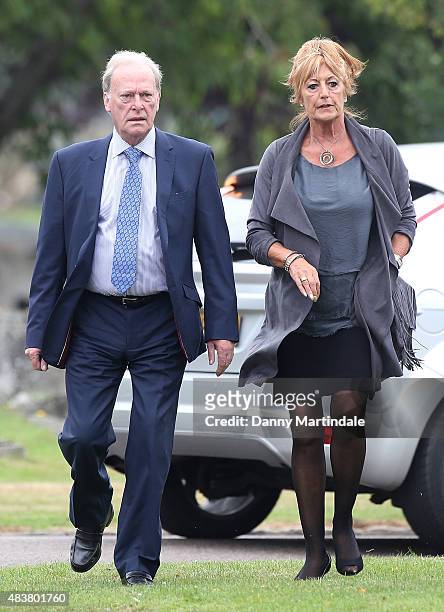 Dennis Waterman and wife Pam Flint attends the funeral of George Cole at Reading Crematorium on August 13, 2015 in Reading, England.