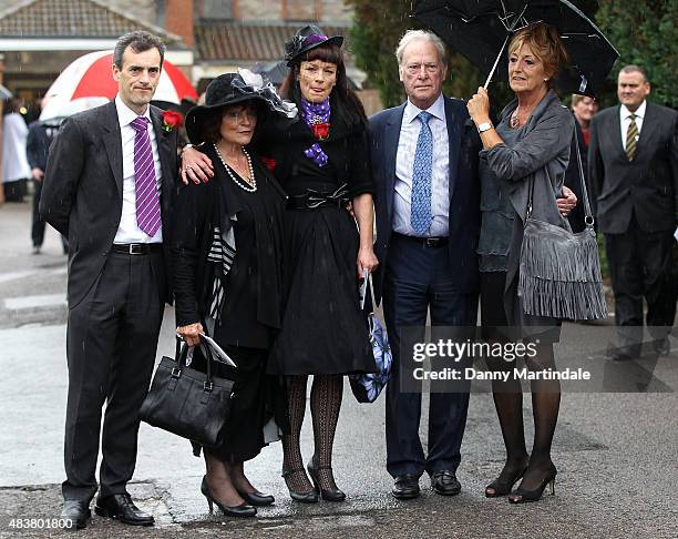 George Cole's Son, his wife Penny Morrell and daughter Tara Cole stand with Actor Dennis Waterman and Dennis Waterman's wife Pam Flint as they attend...