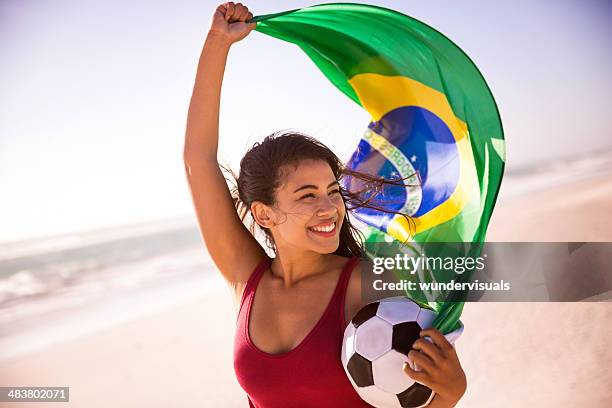 brazilian football fan with flag - brazil girls supporters stock pictures, royalty-free photos & images