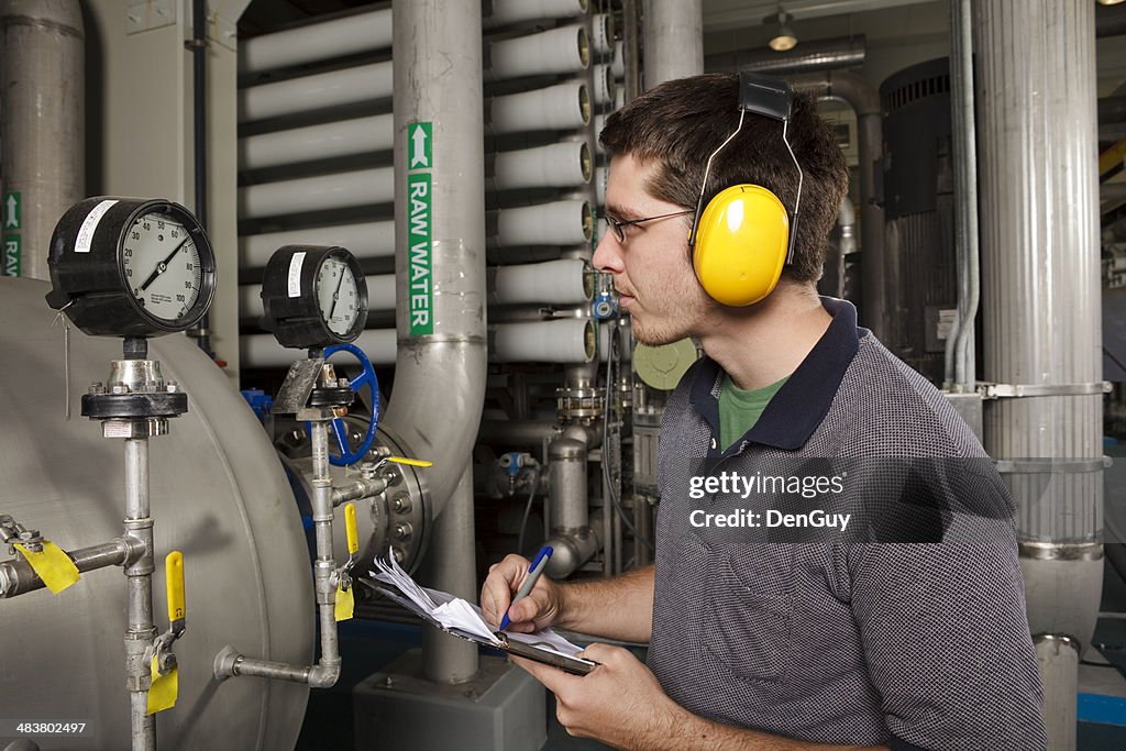 Reverse Osmosis Water Purification Plant Technician Checks System Settings