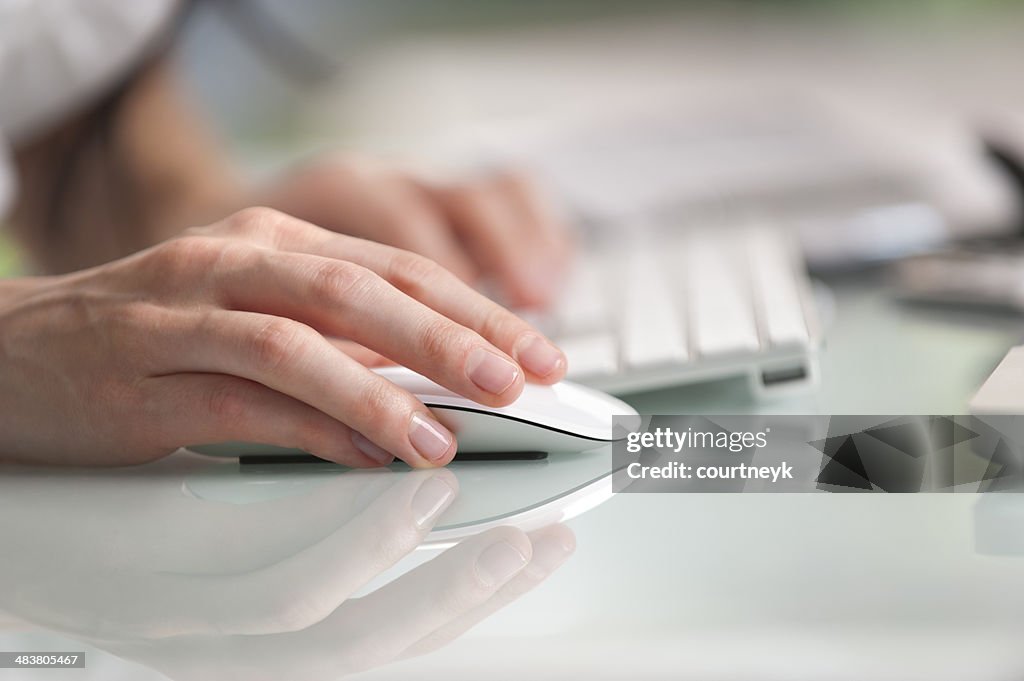 Close up of a hand operating mouse