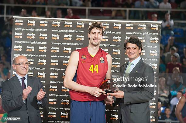 Ante Tomic, #44 of FC Barcelona MVP of March receives the trophy from Diego Guillen, Competition Director of Euroleague Basketball before the...