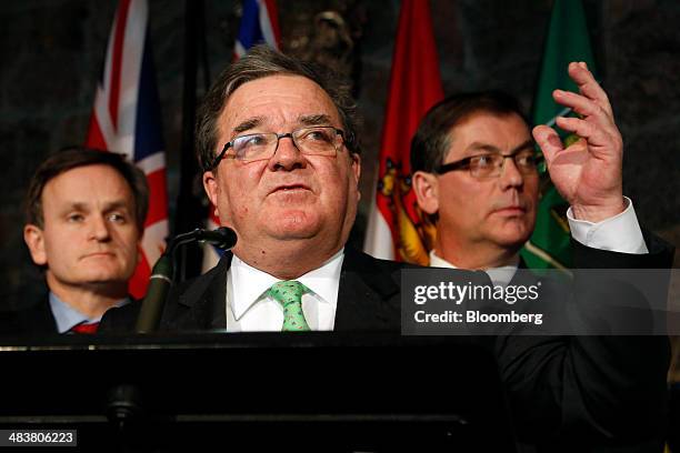 Andrew Saxton, Parliamentary Secretary to the Minister of Finance, left, Jim "James" Flaherty, Canada's finance minister, center, and Kevin Sorenson,...
