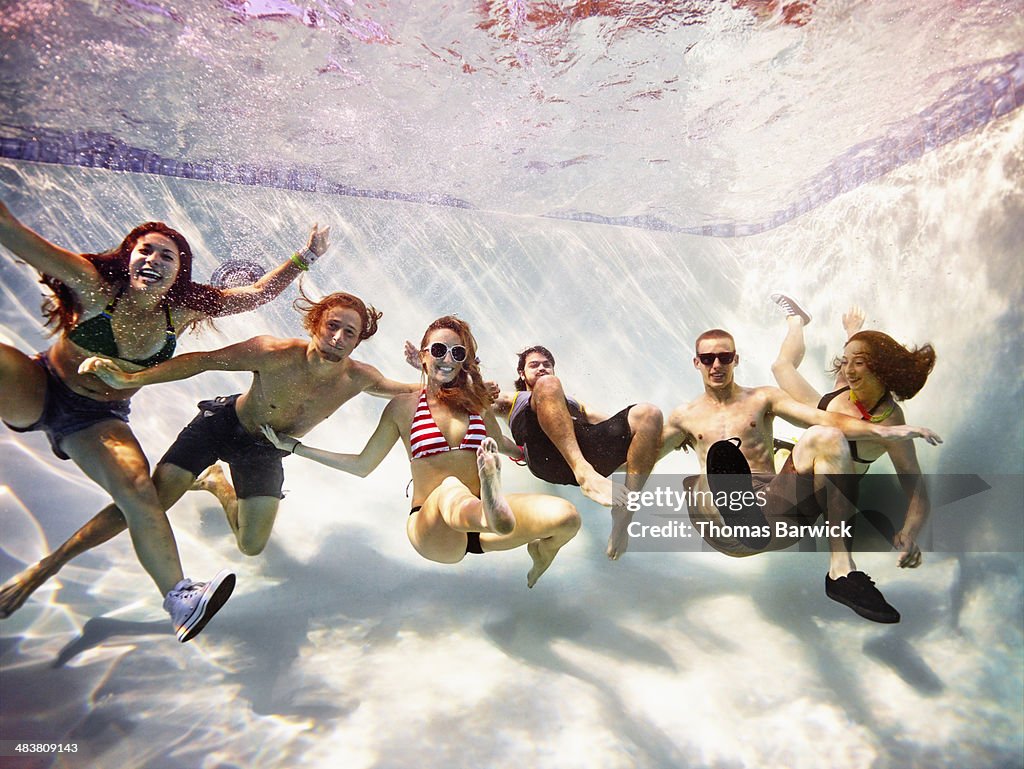 Group of friends embracing underwater