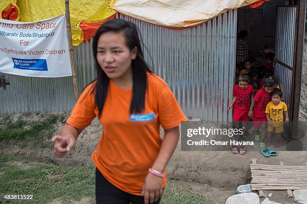 Children exit a child care centre set up inside the Bode displacement camp by the organisation SOS Children's Villages on August 13, 2015 in...