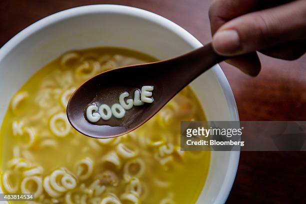 Campbell Soup Co. Letters spell out the word "Google" on a spoon in this arranged photograph taken in New York U.S., on Wednesday, Aug. 12, 2015....