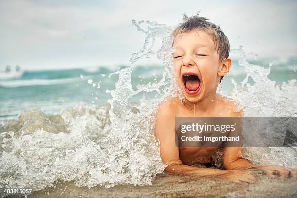 little boy on a beach - beach kids stock pictures, royalty-free photos & images