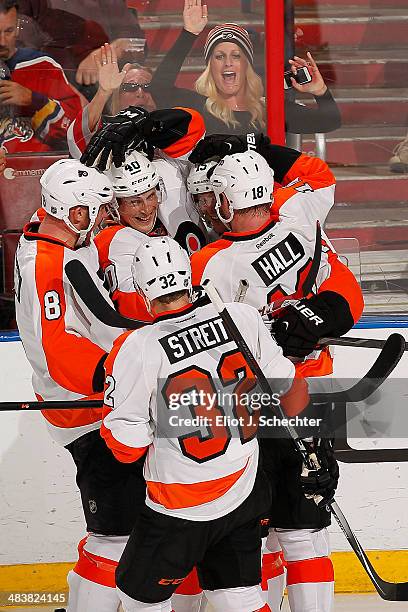 Tye McGinn of the Philadelphia Flyers celebrates his goal with teammates against the Florida Panthers at the BB&T Center on April 8, 2014 in Sunrise,...