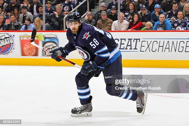 Eric O'Dell of the Winnipeg Jets follows the play up the ice during third period action against the Minnesota Wild at the MTS Centre on April 7, 2014...