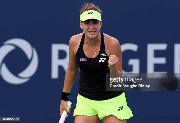 Belinda Bencic of Switzerland celebrates a point against Sabine Lisicki of Germany during Day 4 of the Rogers Cup at the Aviva Centre on August 13,...