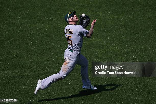 Brett Lawrie of the Oakland Athletics catches a pop up in the eighth inning during MLB game action against the Toronto Blue Jays on August 13, 2015...