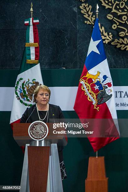 Michelle Bachelet, President of Chile, attends during a conference as part of an official visit to Mexico at Los Pinos official residence on August...