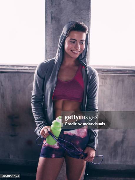 smiling girl in sportswear with jump rope and water bottle - buff headwear stock pictures, royalty-free photos & images