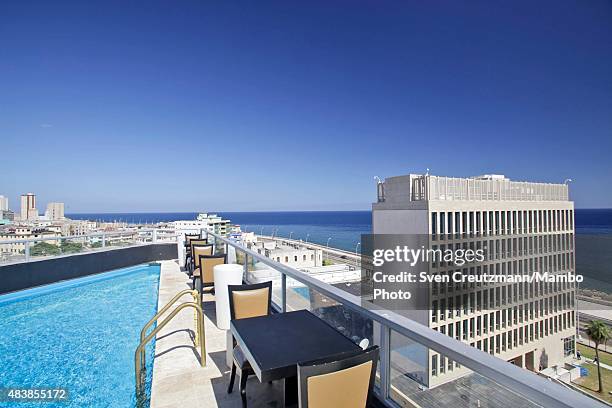The U.S. Embassy in Cuba is seen from the rooftop pool of the La Flauta Magica paladar, private restaurant, at Havanas Malecon waterfront, on August...