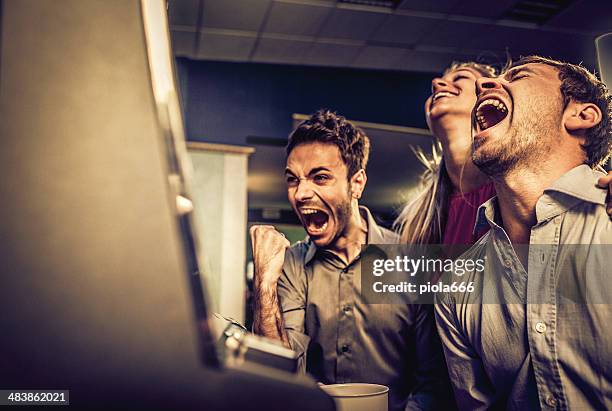people playing slot machine at casino - jackpot stock pictures, royalty-free photos & images