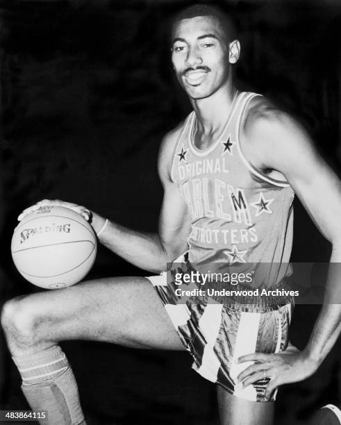 All-Star basketball player Wilt Chamberlain wearing a Harlem Globetrotters uniform, 1959.