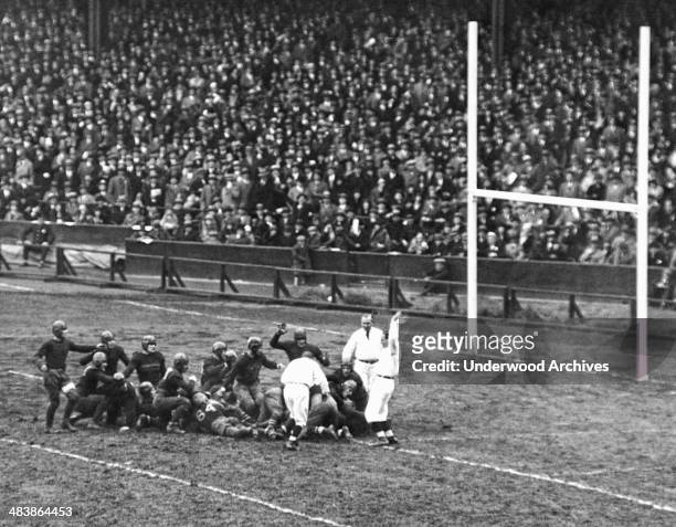Jack Chevigny of Notre Dame scores a touchdown in the third quarter to tie the game against Army at Yankee Stadium, New York, New York, November 10,...